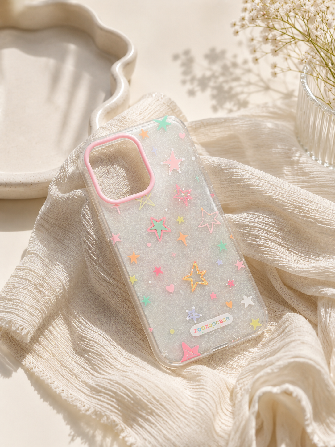 Phone case with star pattern on a textured surface